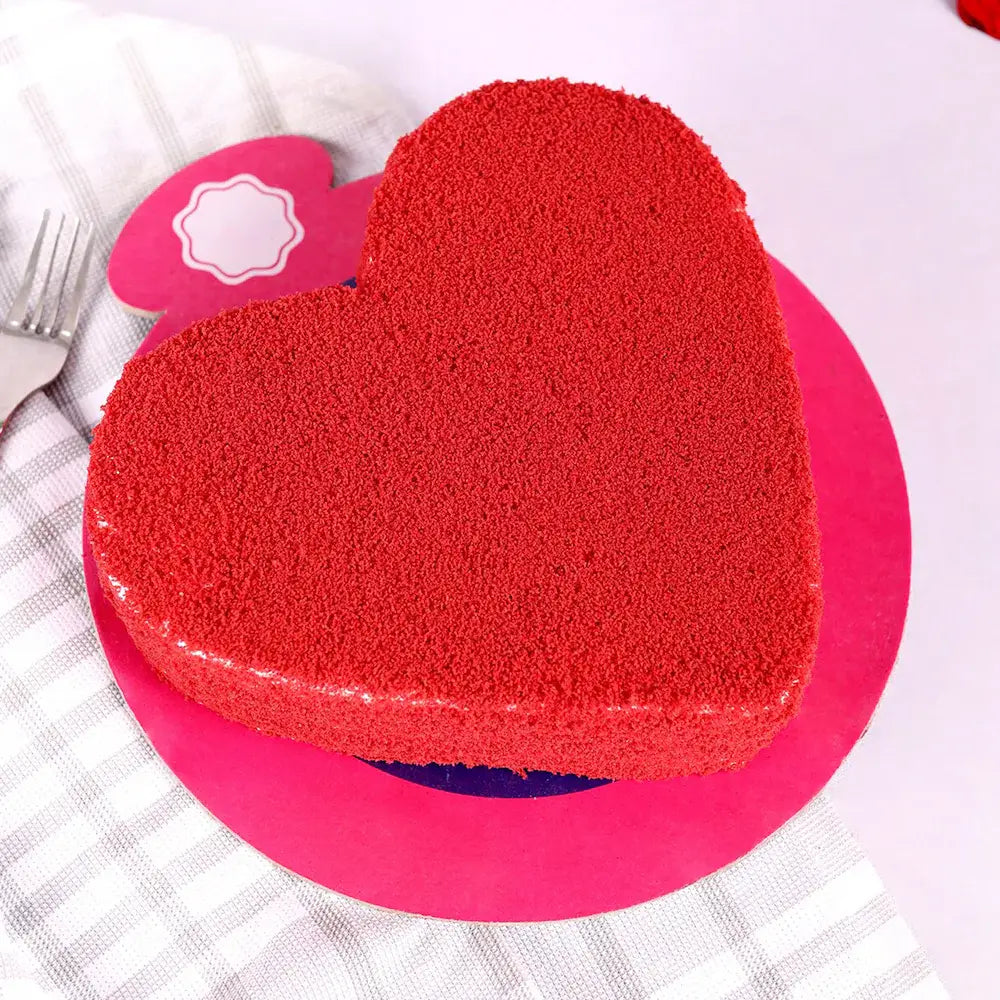 Love Expression Red Velvet Cake in heart shape, perfect for Valentine's Day or special occasions, available for quick delivery.