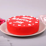 Round Valentines Special Black Forest Cake with red mirror glaze and romantic white icing, ideal for Valentine's Day gifting and online delivery.