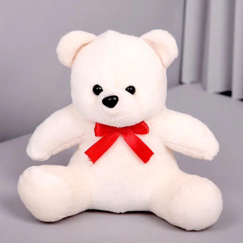 Plush white teddy bear with red ribbon bow, part of the Love Forever Combo gift set. Perfect for romantic and festive celebrations.