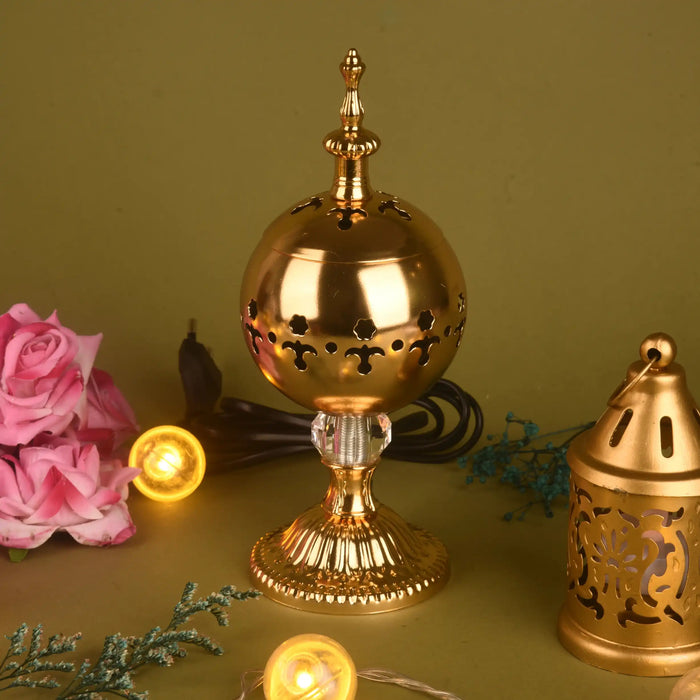 Golden Essence Burner for fragrance diffusion with ornate detailing, electric cord, and decorative base. Ideal for Diwali home decor and gifting.