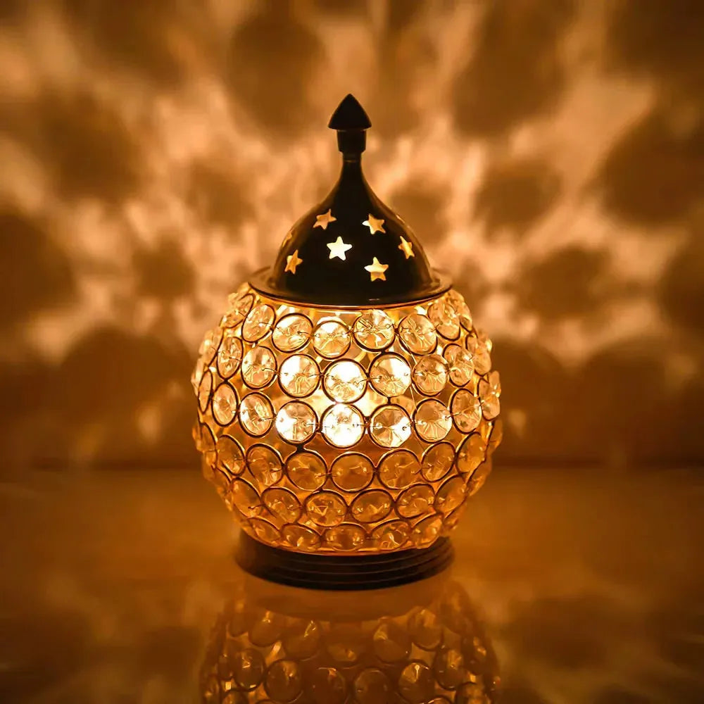 Brass Tea Light Holder - Elegant Design with crystal-studded glass and star-cut brass top, casting warm ambient light for festive home décor.