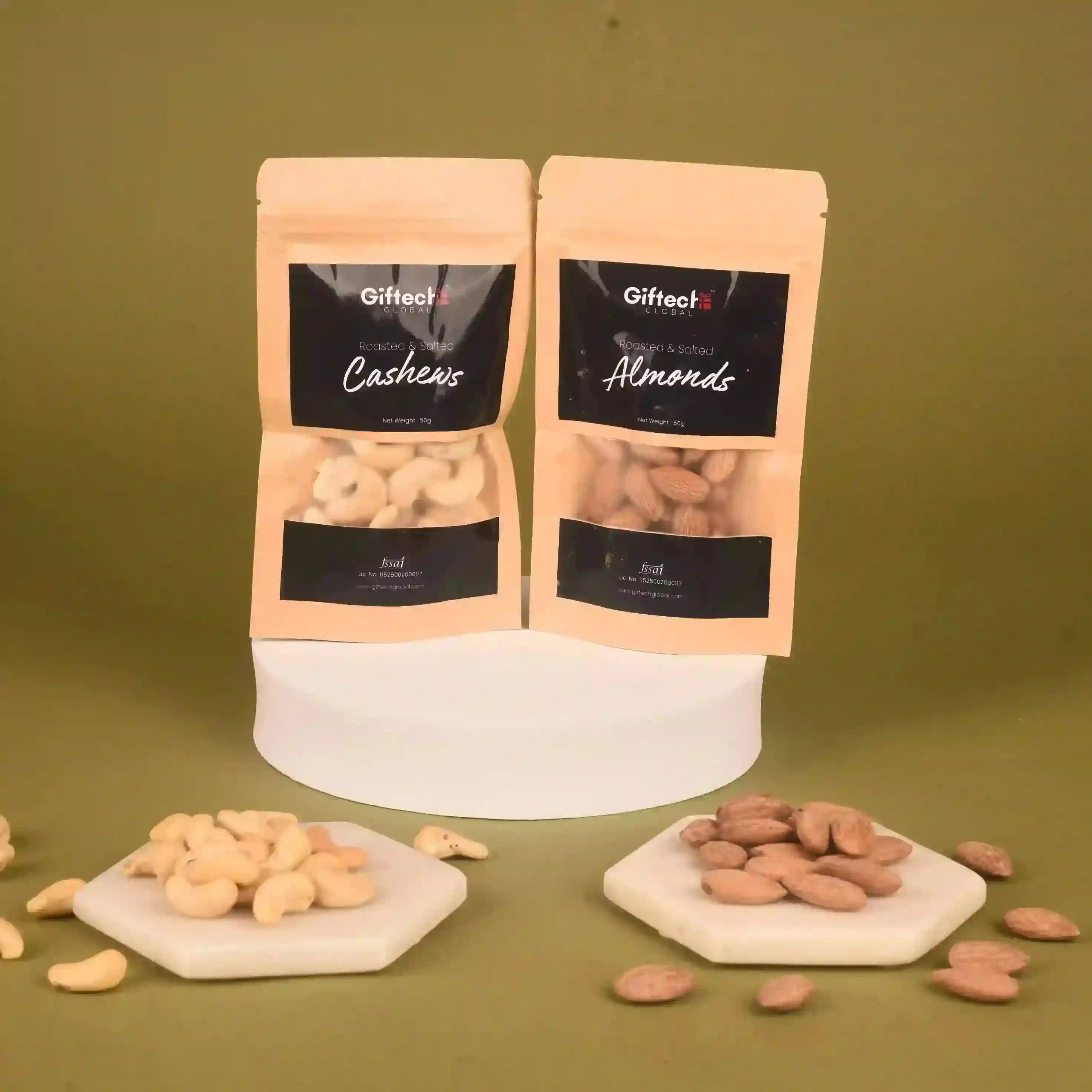 Two packages of Giftech Cashews and Almonds on a green background