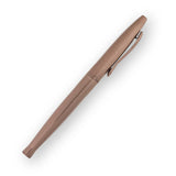 Rose gold pen on a white background