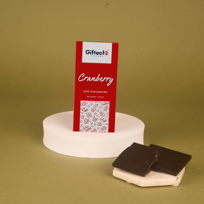 Canberry Dark Chocolate Bar - Cranberry | 65g displayed upright with chocolate squares beside it, ideal for gourmet chocolate lovers.