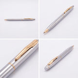 Silver pen with gold accents on a white background