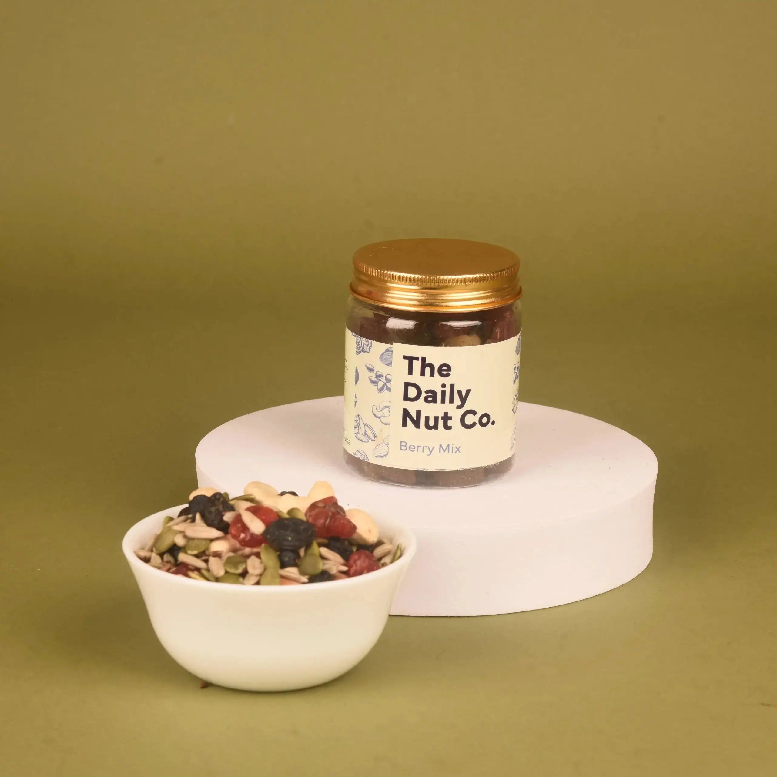 The Daily Nut Co. Berry Mix jar from the Layers of Luxury Hamper, a nutritious and colorful dry fruit blend for gifting.