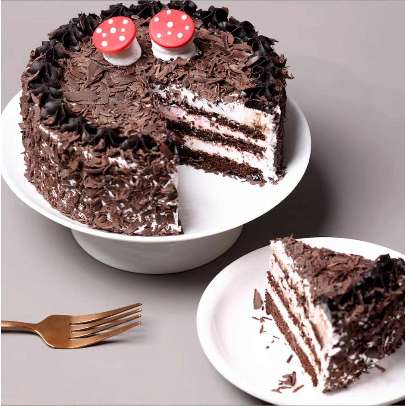 Slice of chocolate cake with cream filling and chocolate shavings