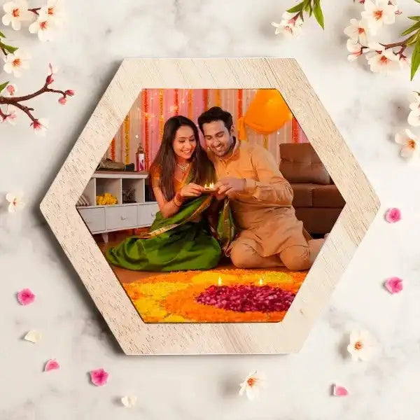Festive acrylic Diwali Photo Frame displayed on a decorated table with diyas and rangoli.