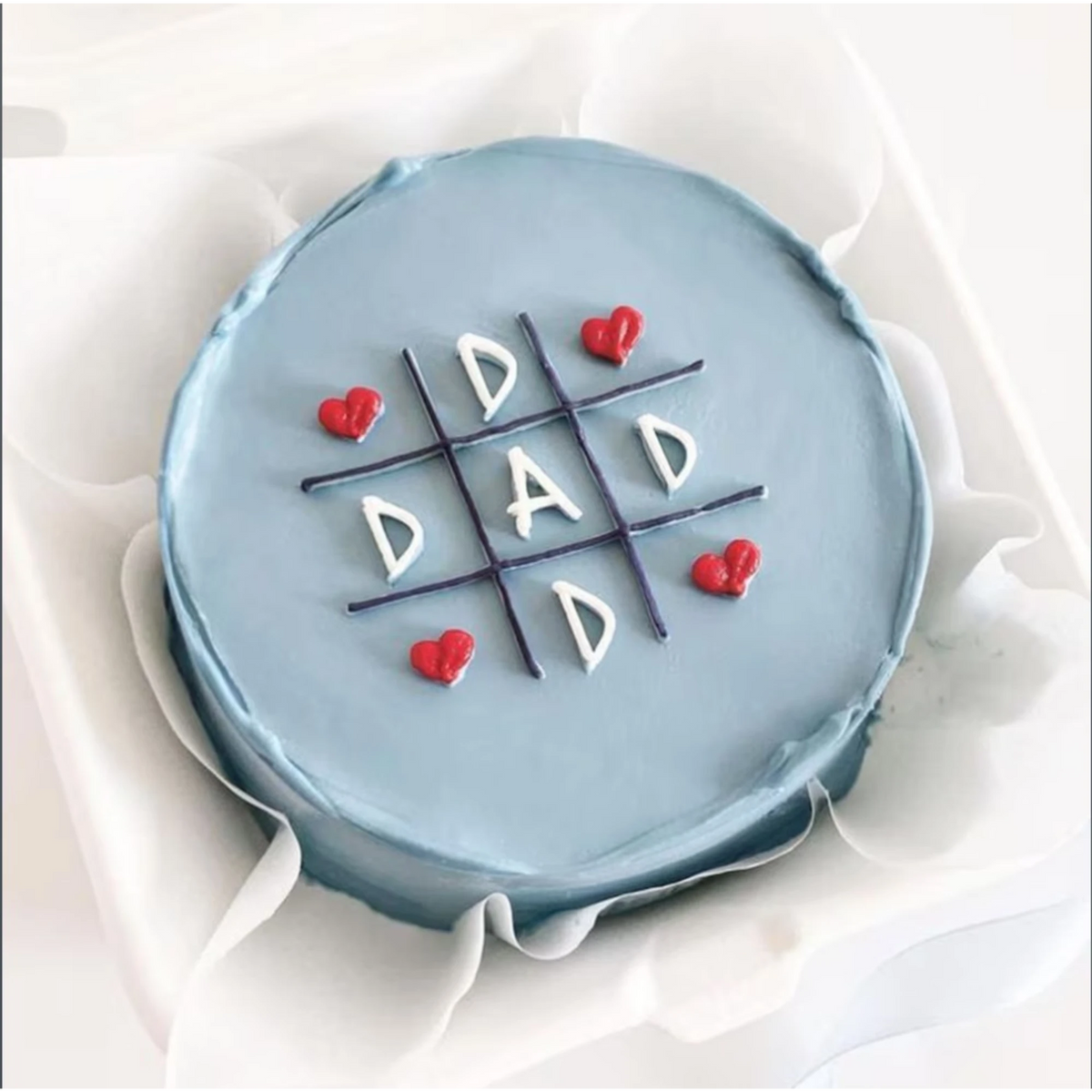 Blue birthday cake with hearts and 'Dad' message