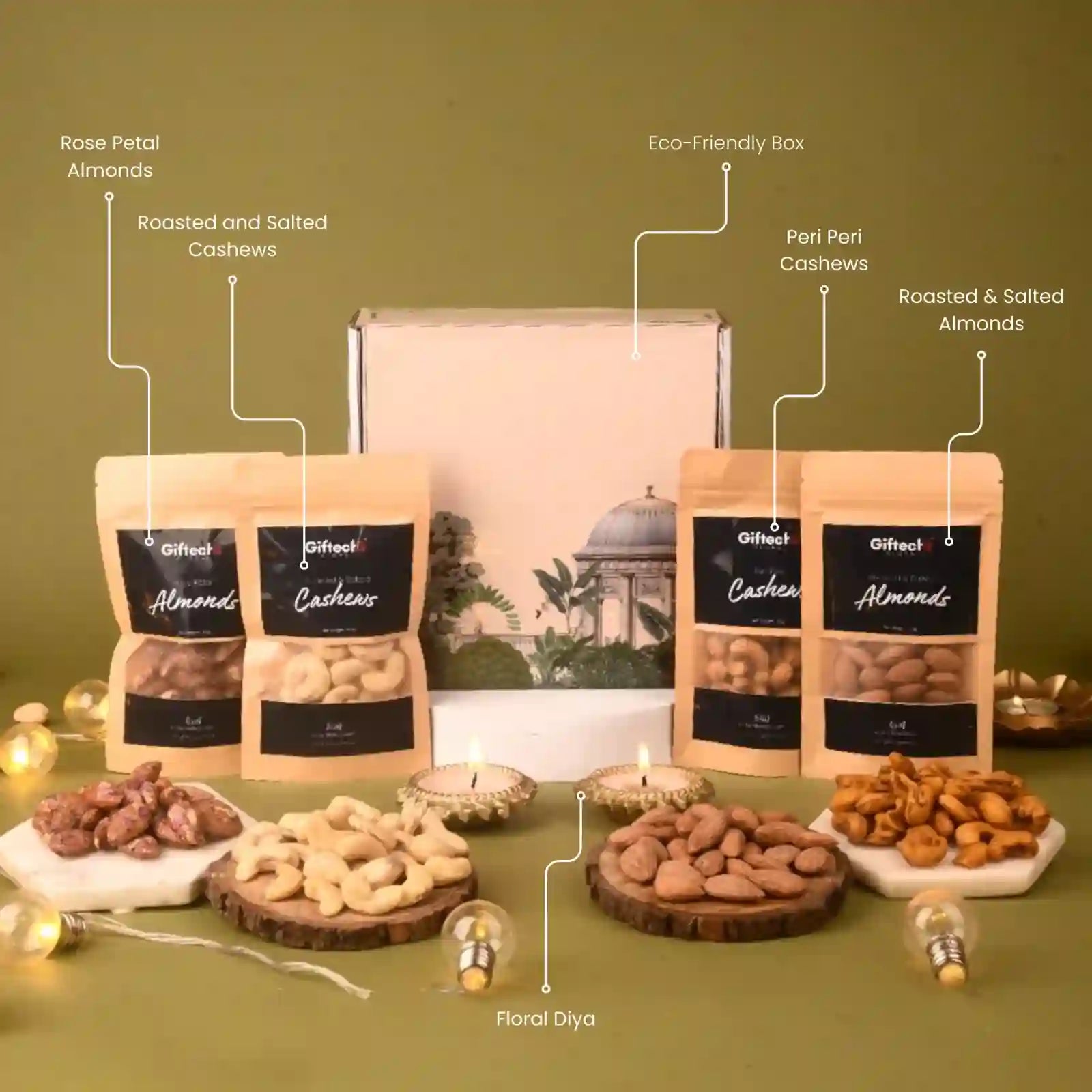 Assorted nuts in packaging with decorative elements on a green background