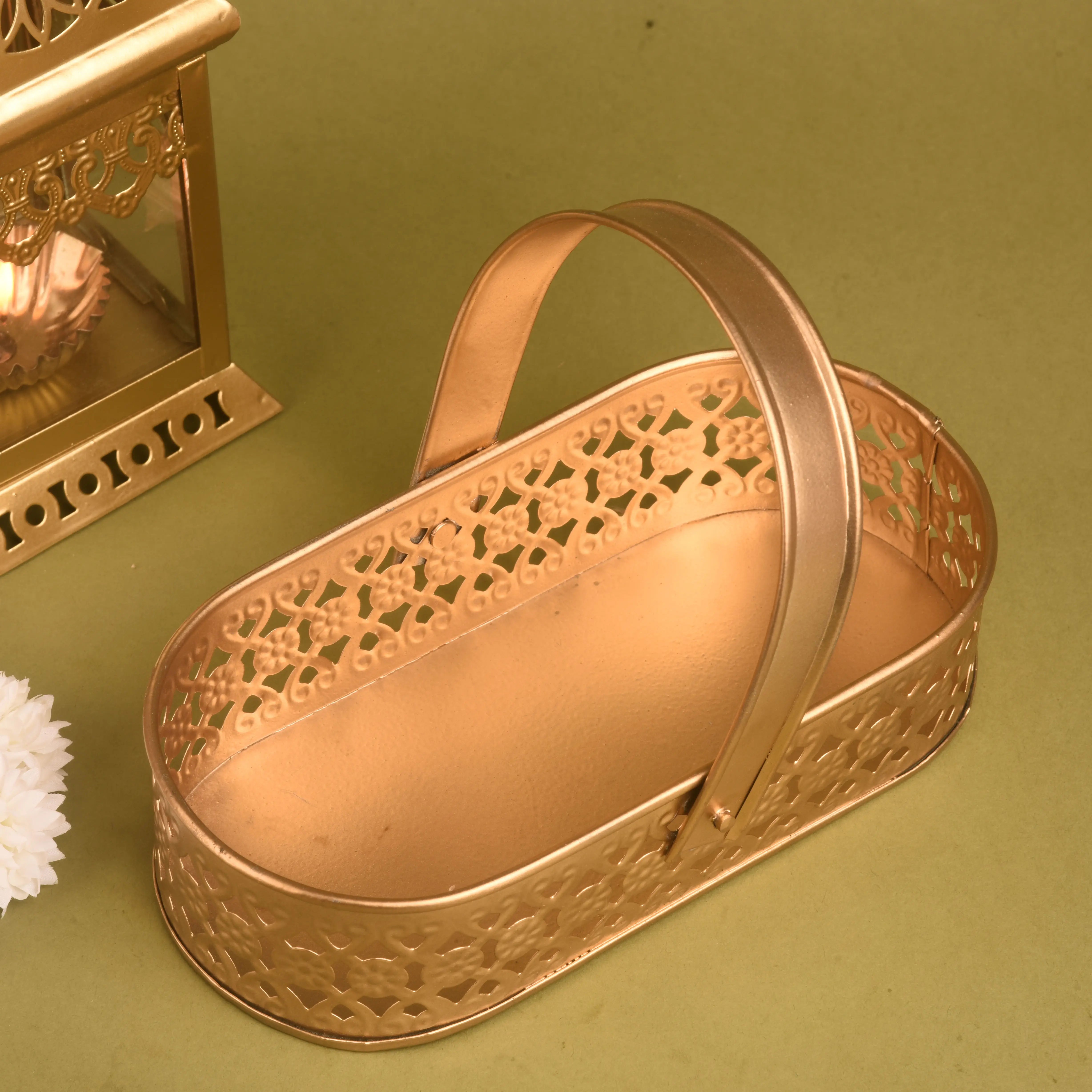 Decorative gold heart-shaped box on a green background