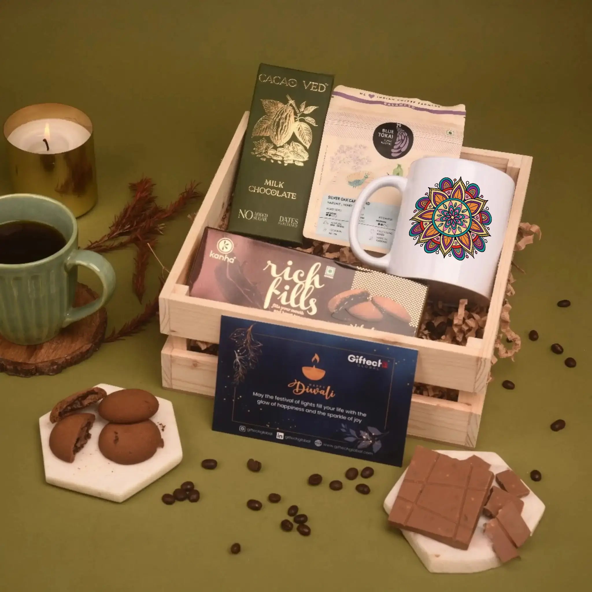 Gift basket with chocolate, coffee, and a mug on a green background