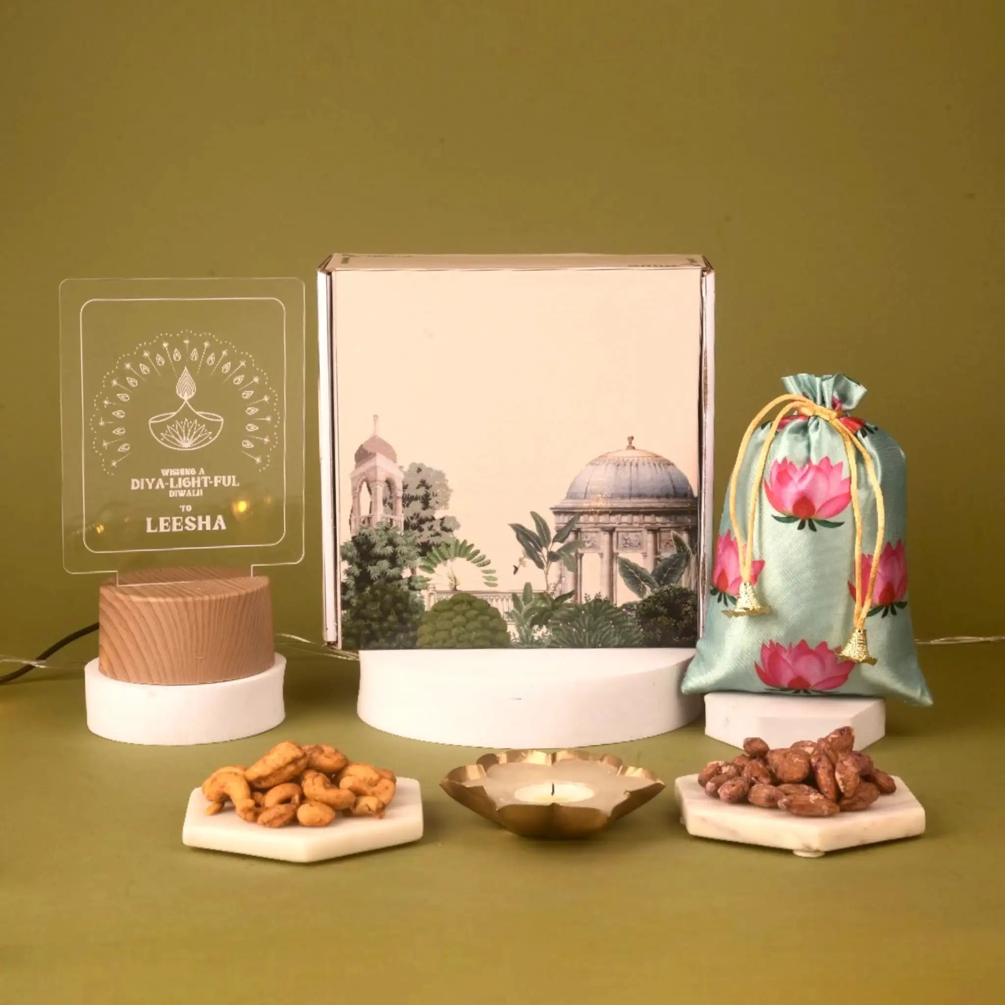 Elegant Nutty Indulgence Hamper for Diwali Gifting with lotus pouch, assorted nuts, diya, and personalized LED plaque in a premium gift box.