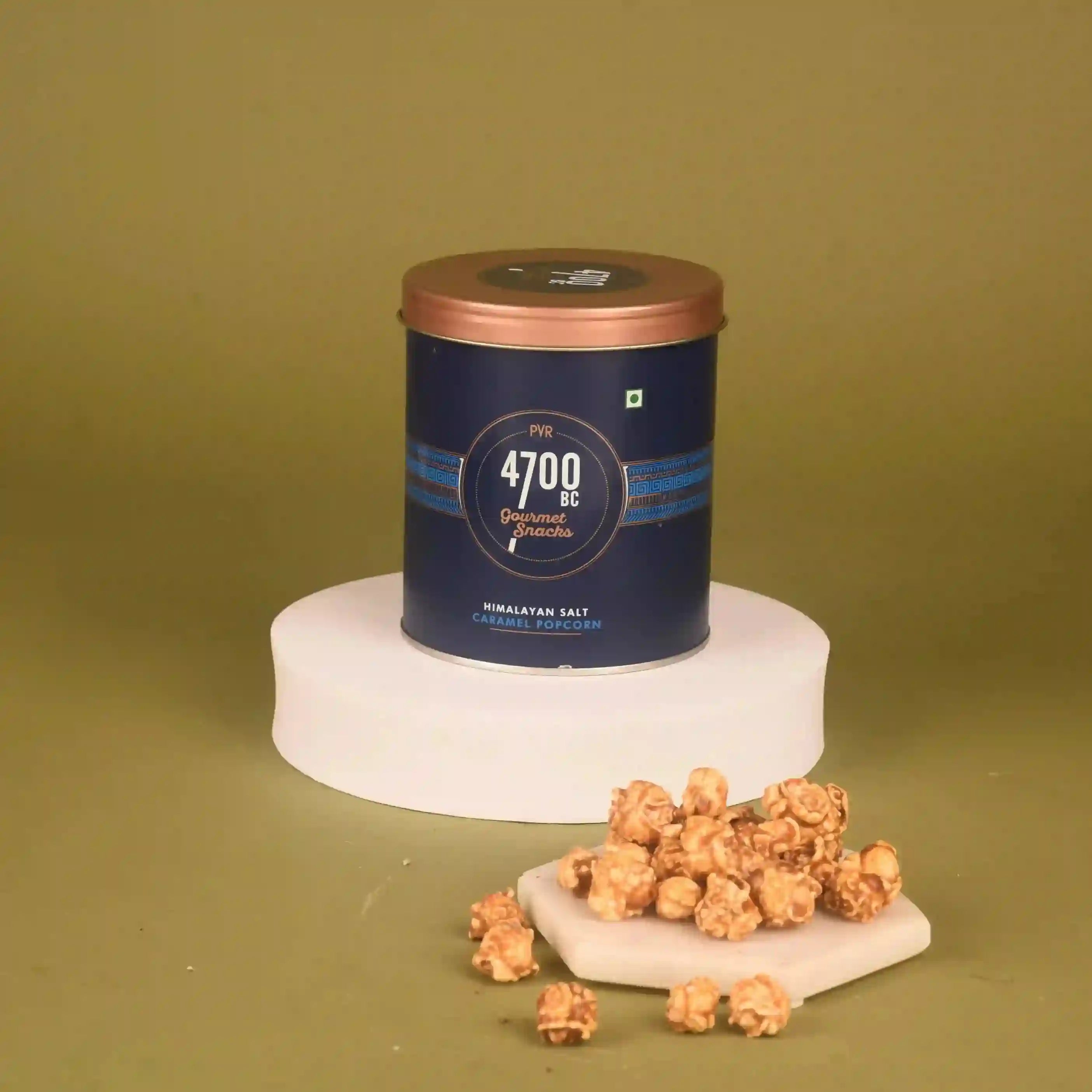 Caramel popcorn with a canister labeled '4700 BC' on a green background