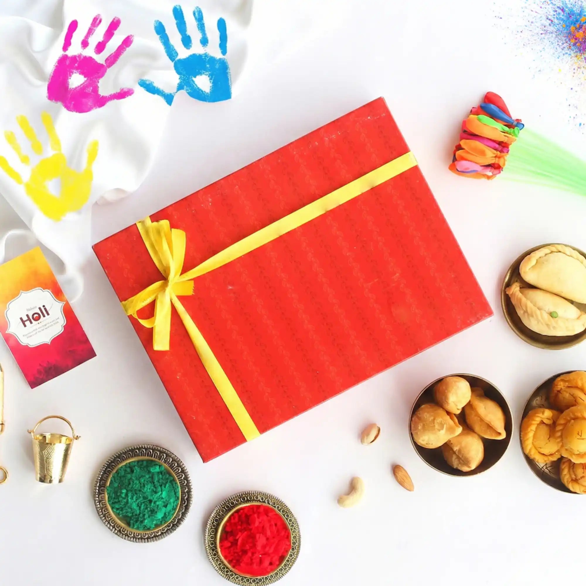 Colorful Holi celebration with gift box and powders
