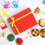 Colorful Holi celebration with gift box and powders
