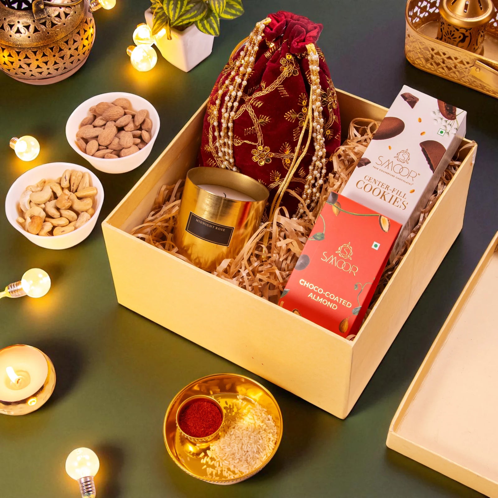 Eternal Diwali Hamper with pooja thali, candle, dry fruits, and snacks in a festive gift box, ideal for corporate Diwali gifting.