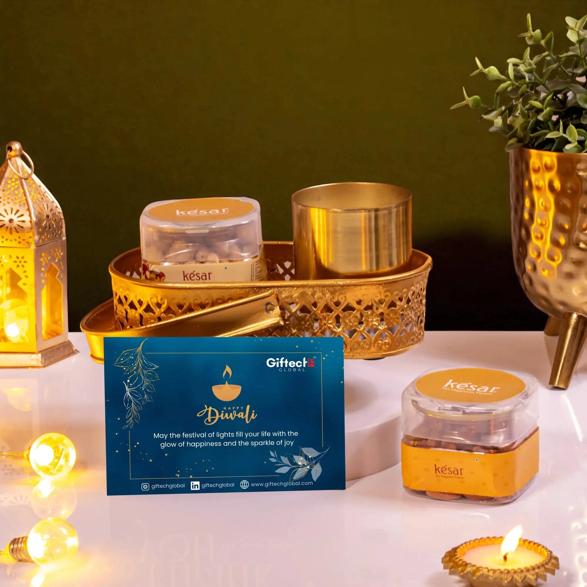 Festival Of Lights Gift Hamper includes Diwali greeting card, dry fruits, gold candle, and decorative tray. Great for employee appreciation.