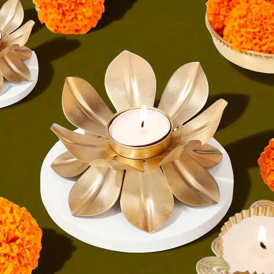 Golden lotus-shaped Diwali diya included in the Layers of Luxury Hamper, adding a festive and elegant touch to the gift set.