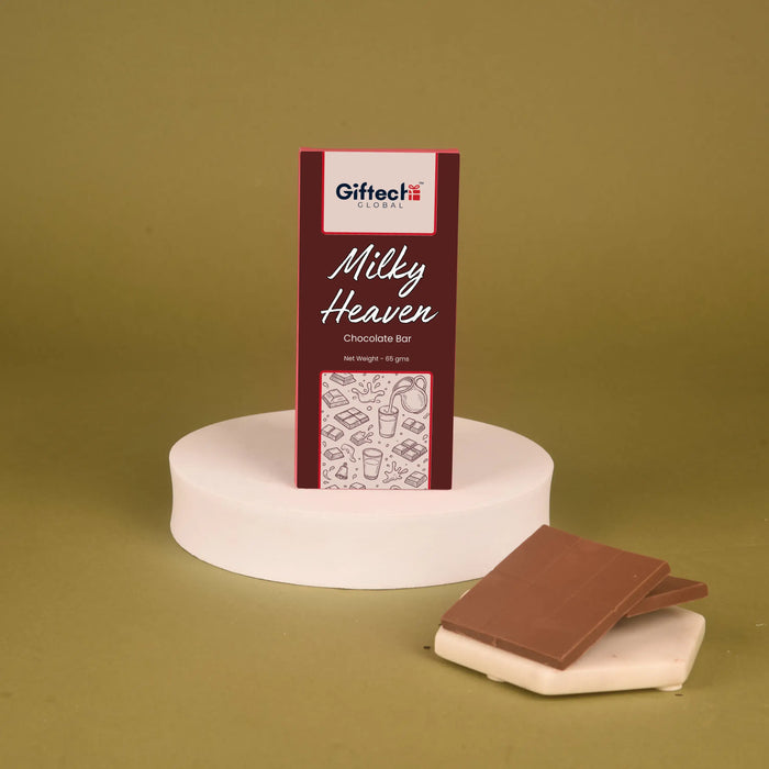 Milky Heaven Milk Chocolate Bar - Classic | 65g displayed upright with chocolate squares on a white platform, ideal for candy lovers and gift add-ons.