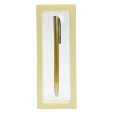 Gold pen in a beige box on a white background