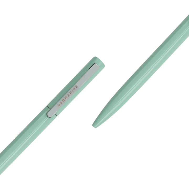 Two light green pens with 'Submarine' branding on a white background