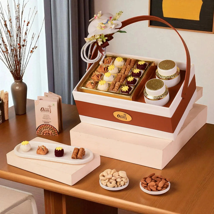 The Heritage Gourmet Tray | Gift Hampers Online featuring assorted baklawa, fusion balls, plain cashews, and almonds in a premium gift box.