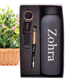 Gift set with water bottle, keychain, and pen in a box with 'Zohra' branding.
