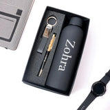 Gift set with water bottle, keychain, pen, and watch on a white background