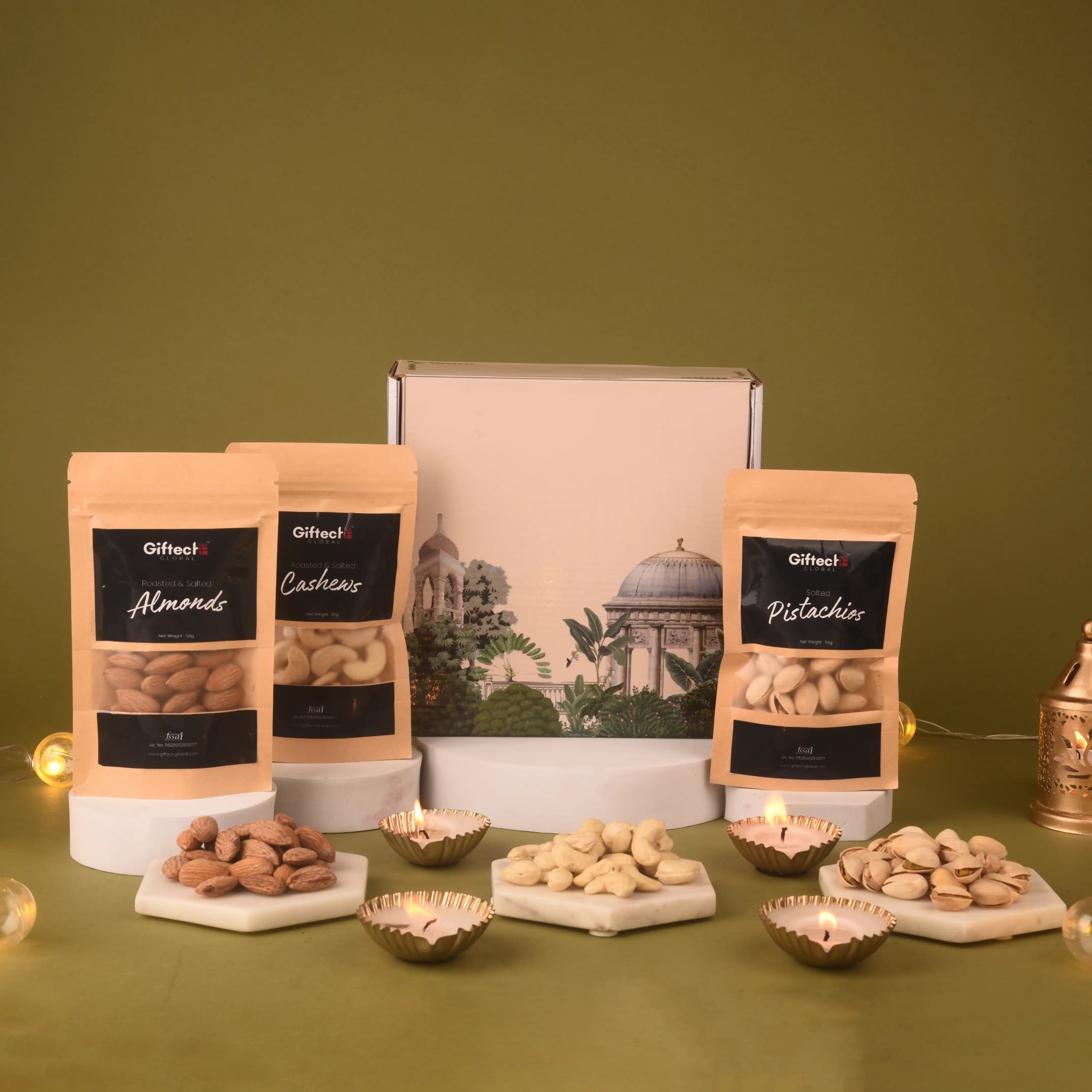Three bags of almonds, cashews, and pistachios with their packaging on a green background.