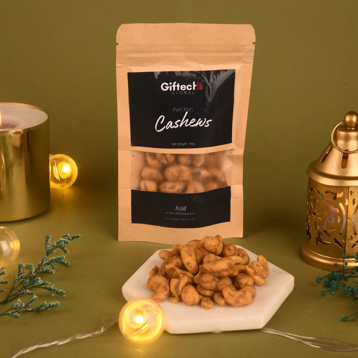 Spicy Cashews - Peri Peri Roasted 50g pack displayed with festive lights and decor, showcasing crunchy snack from Gifted Gourmet.