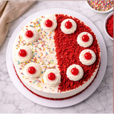 Decorated birthday cake with cherries and colorful sprinkles