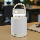 Solar-powered lantern on a table with a blurred background