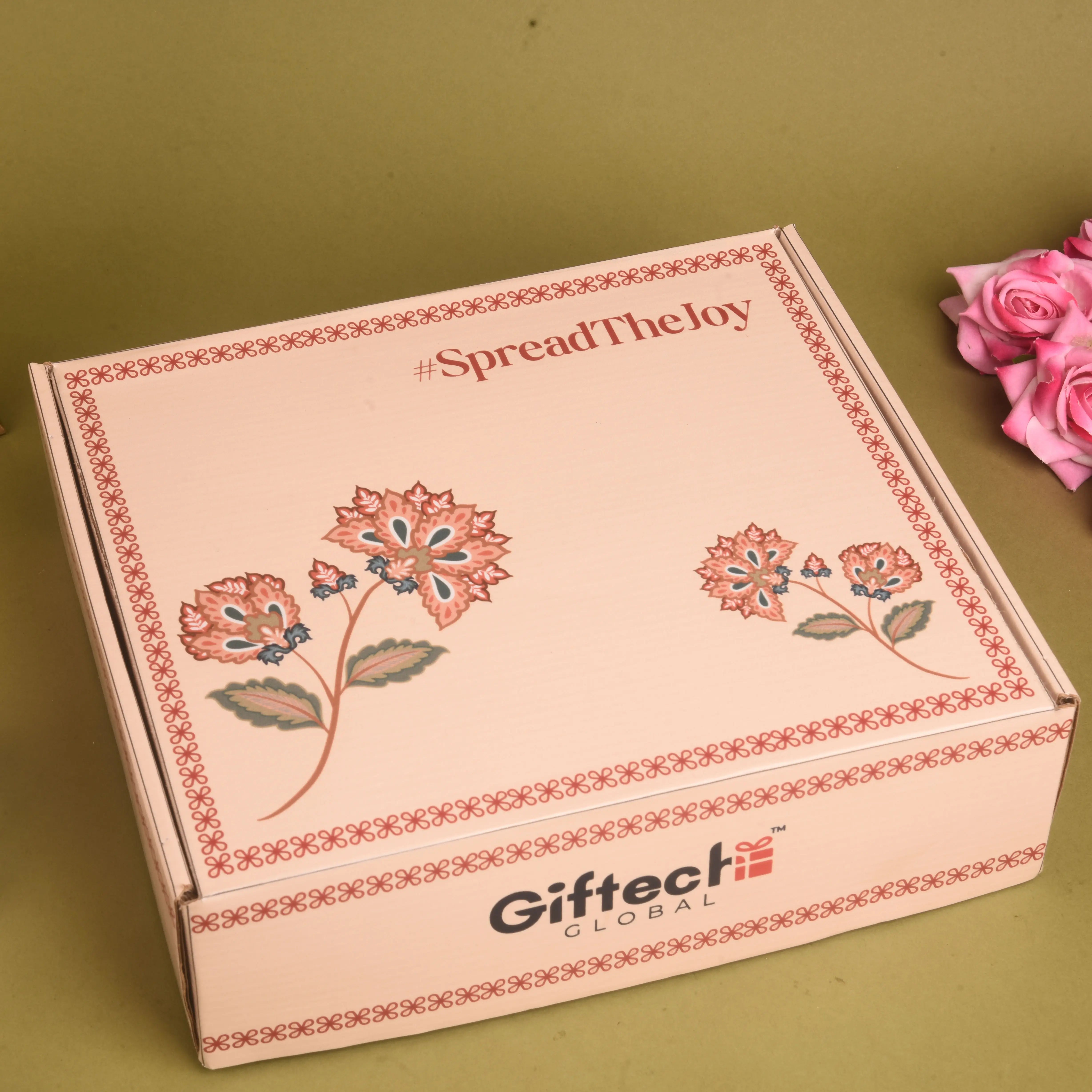 Gift box with floral design and 'Giftech Global' branding on a green background