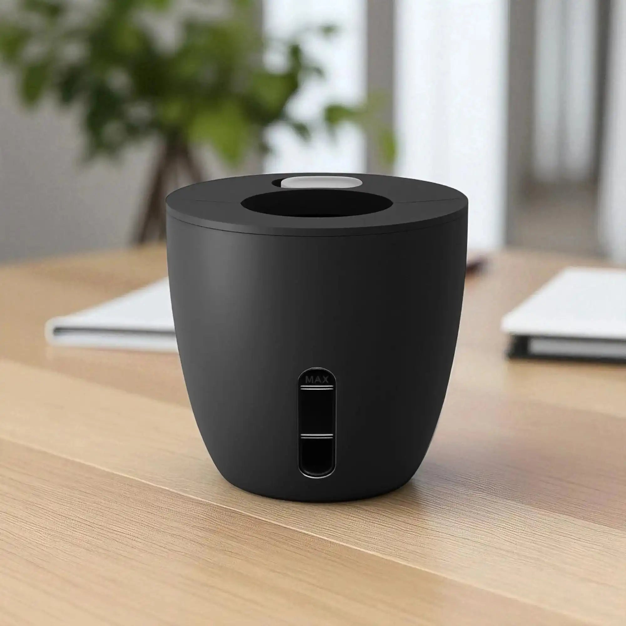 Black cylindrical device on a wooden surface 