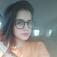 Woman wearing glasses inside a vehicle