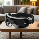 Black and gray XECH device on a wooden table with a blurred living room background
